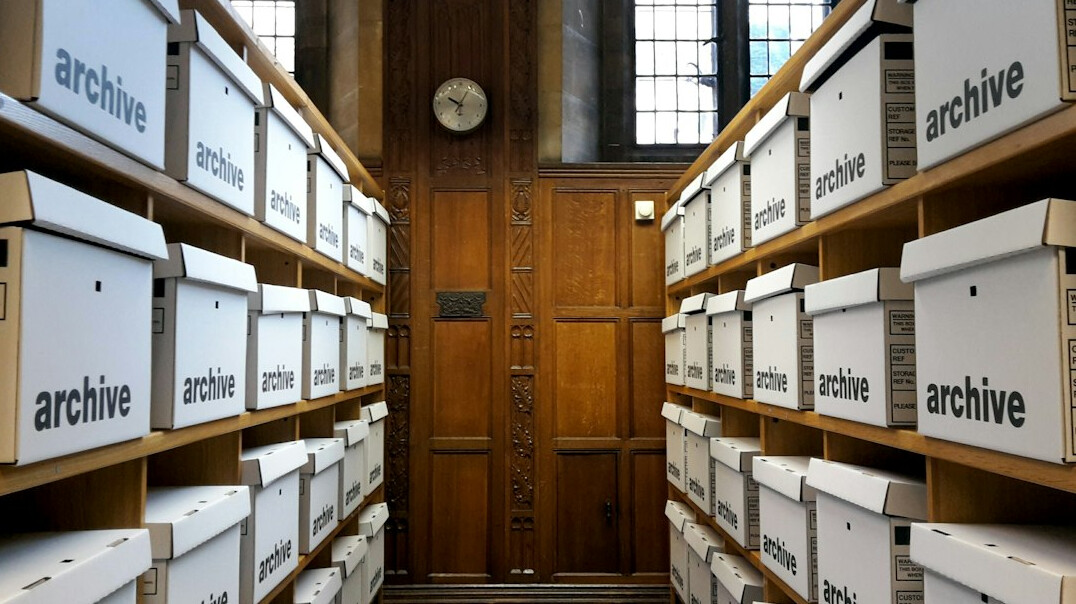 person in library archives